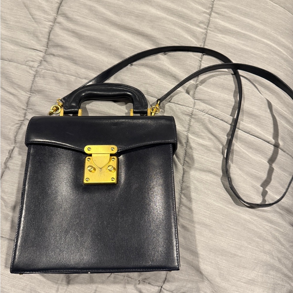 Elegant vintage Black Leather Handbag with Gold Accents